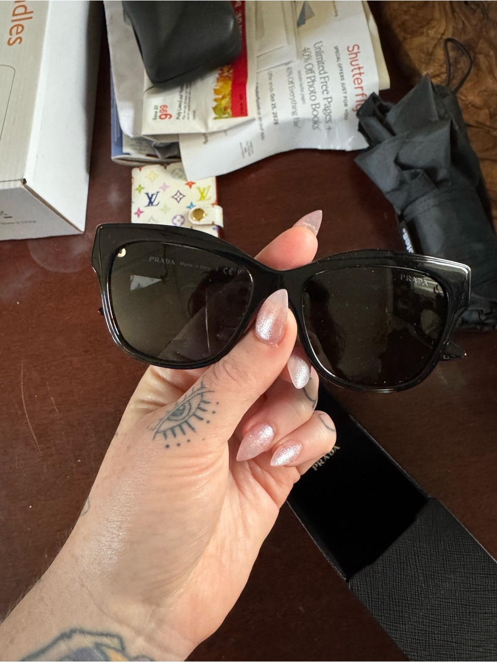 Prada Black Cat-Eye Sunglasses with Dark Lenses